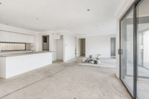 Empty new-build interior with construction dust before a builders clean
